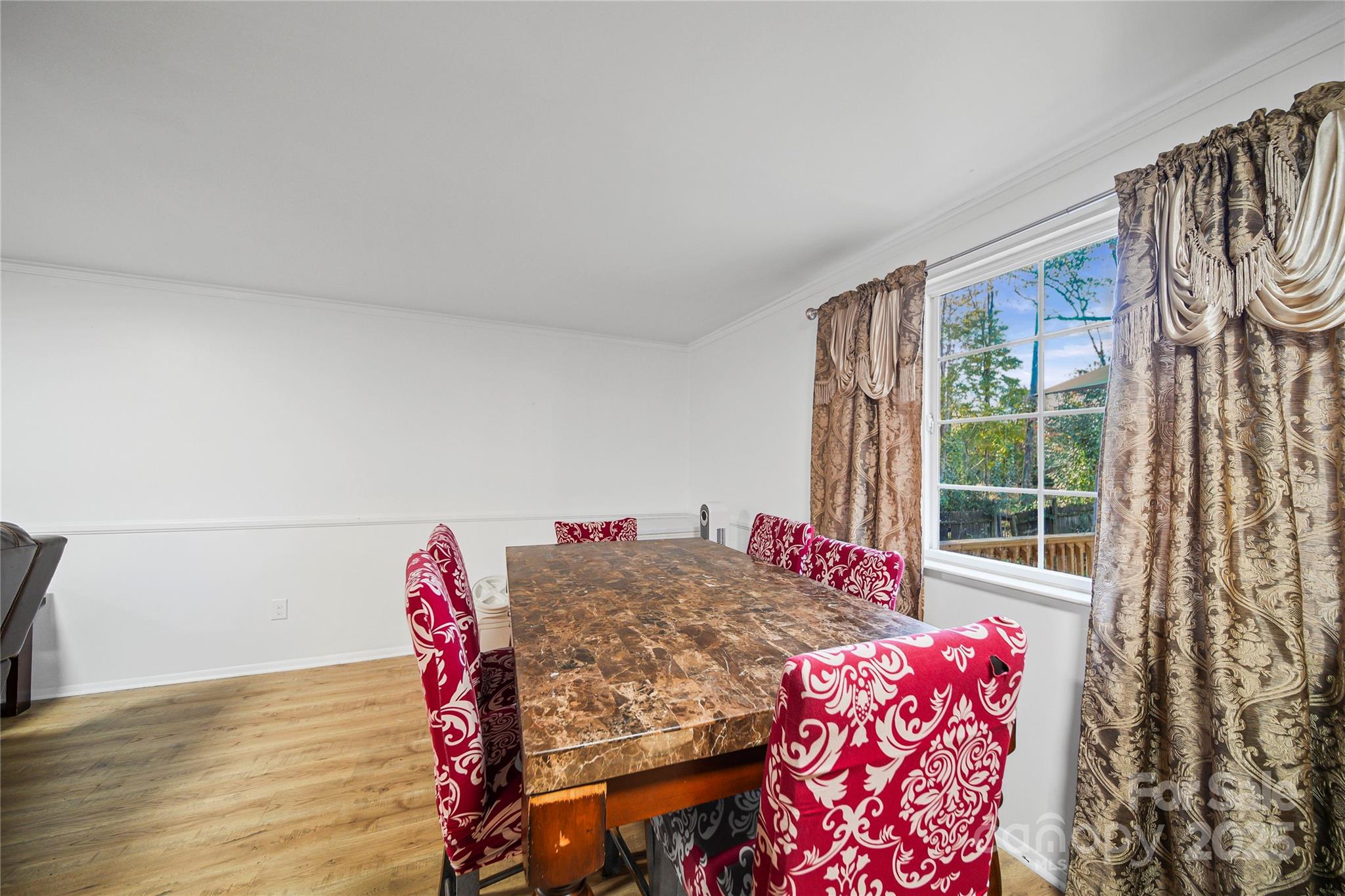 4823 Smokehollow Road Charlotte, NC 28227 - Photo 6 of 31 a view of a bedroom with furniture and staircase