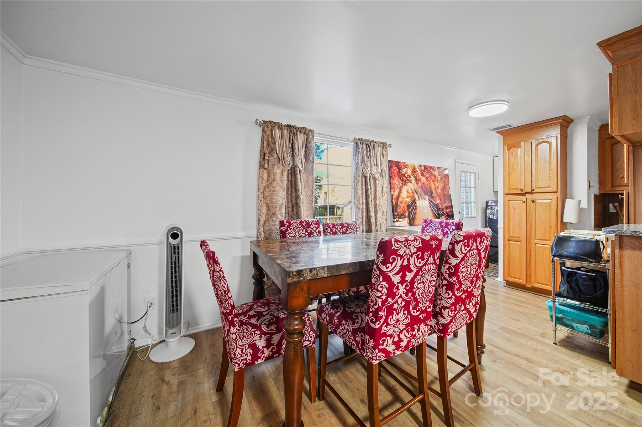 4823 Smokehollow Road Charlotte, NC 28227 - Photo 7 of 31 a view of a dining room with furniture and window