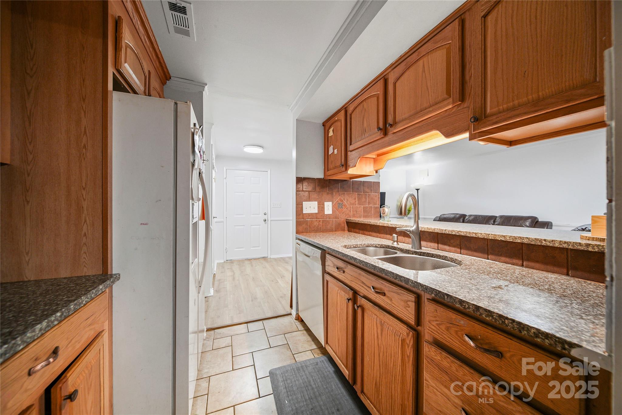 4823 Smokehollow Road Charlotte, NC 28227 - Photo 9 of 31 a kitchen with stainless steel appliances granite countertop a sink stove and refrigerator