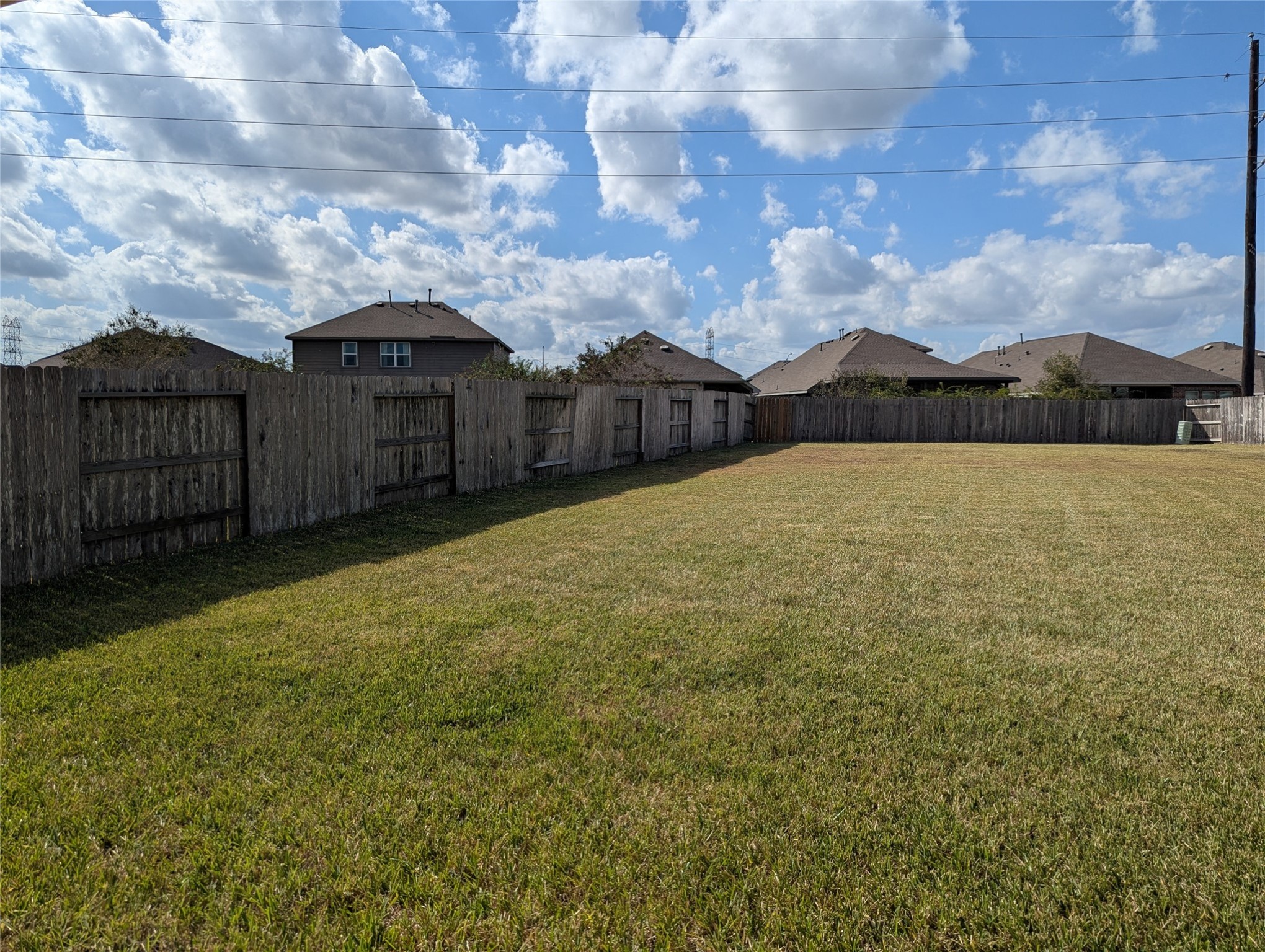 13319 Lansdown Street Rosharon, TX 77583 - Photo 21 of 22 a view of a large house with a big yard and large trees