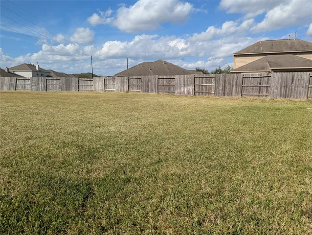 a house view with swimming pool in front of it