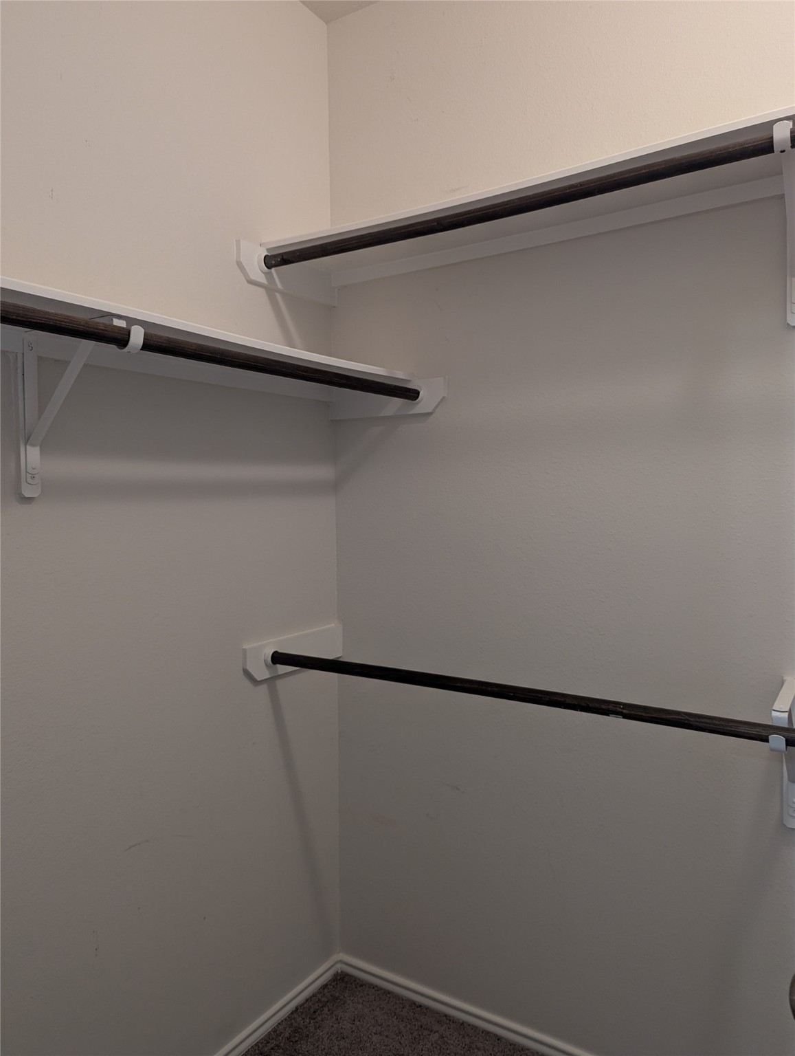 13319 Lansdown Street Rosharon, TX 77583 - Photo 10 of 22 a view of a room with racks on the wall