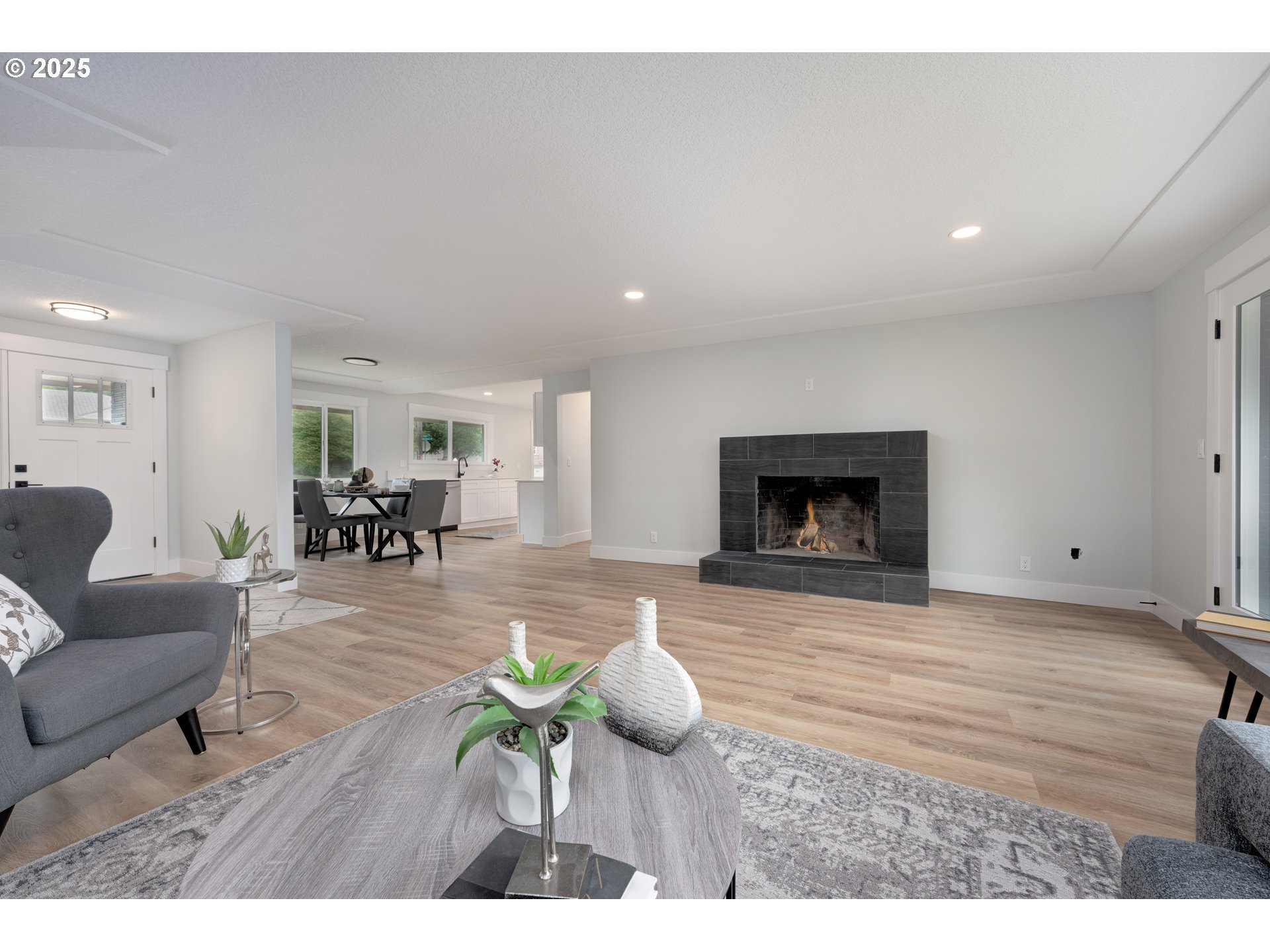 5775 Southeast Cesar Estrada Chavez Boulevard Portland, OR 97202 - Photo 11 of 43 a living room with furniture and a fireplace