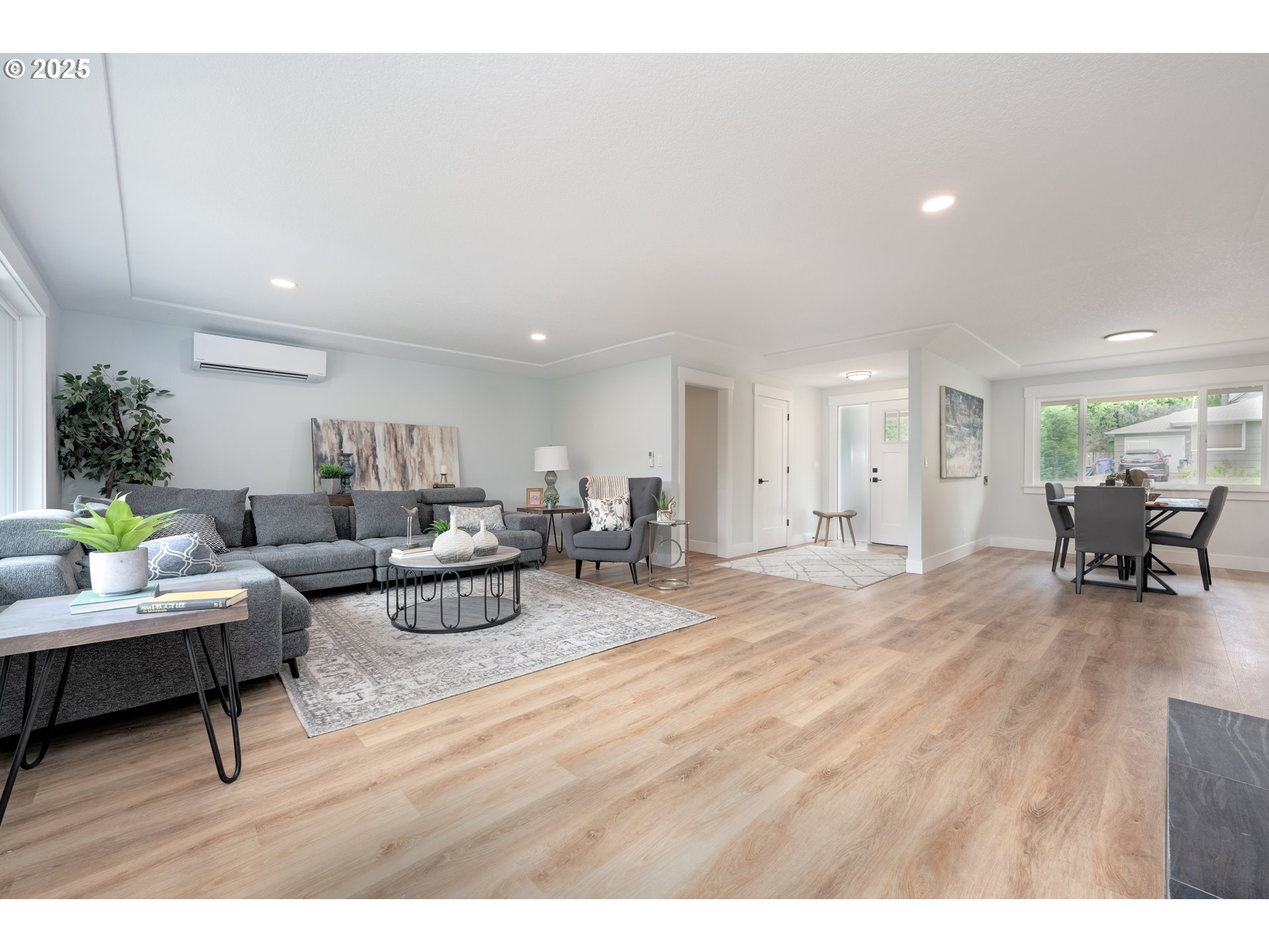 5775 Southeast Cesar Estrada Chavez Boulevard Portland, OR 97202 - Photo 12 of 43 a living room with furniture and a wooden floor
