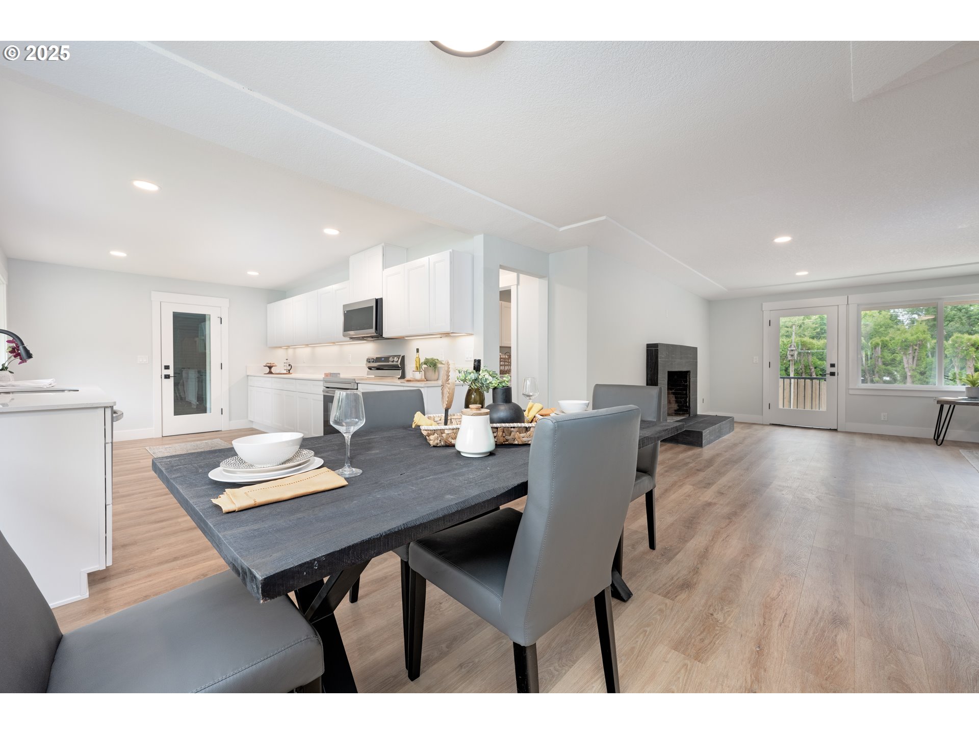5775 Southeast Cesar Estrada Chavez Boulevard Portland, OR 97202 - Photo 13 of 43 a view of a dining room with furniture and wooden floor