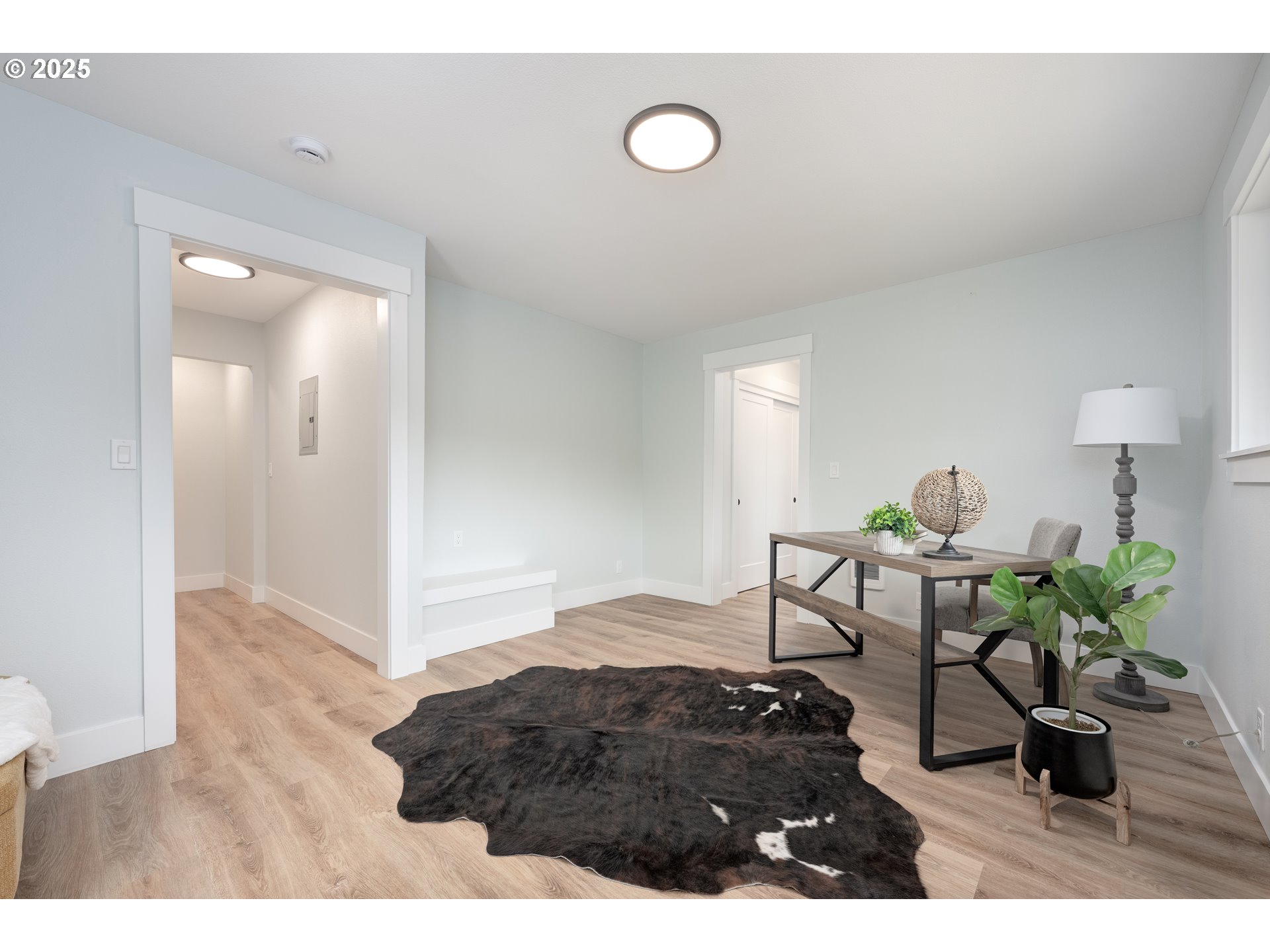 5775 Southeast Cesar Estrada Chavez Boulevard Portland, OR 97202 - Photo 21 of 43 a living room with furniture and a wooden floor