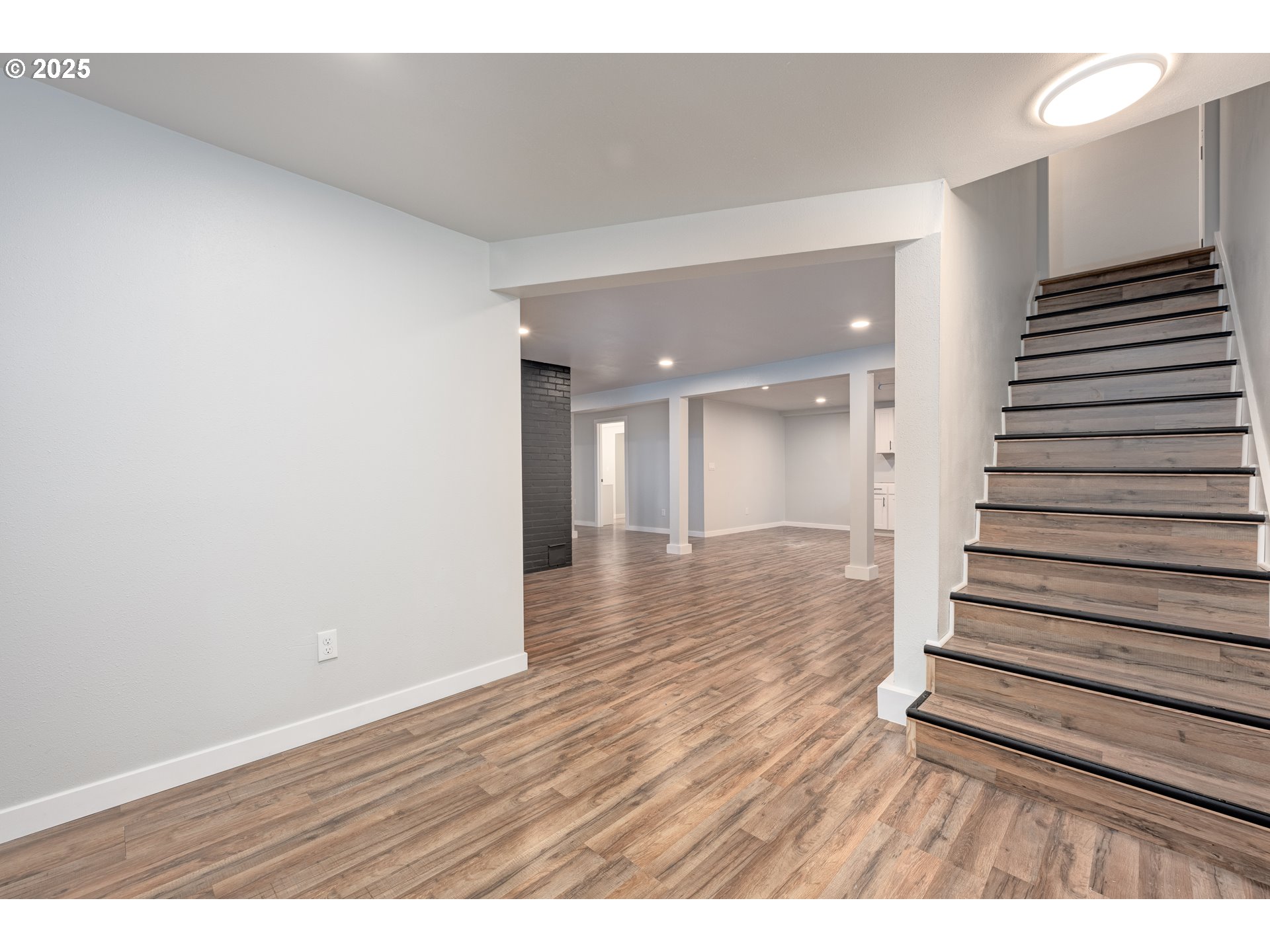 5775 Southeast Cesar Estrada Chavez Boulevard Portland, OR 97202 - Photo 23 of 43 a view of an empty room with wooden floor