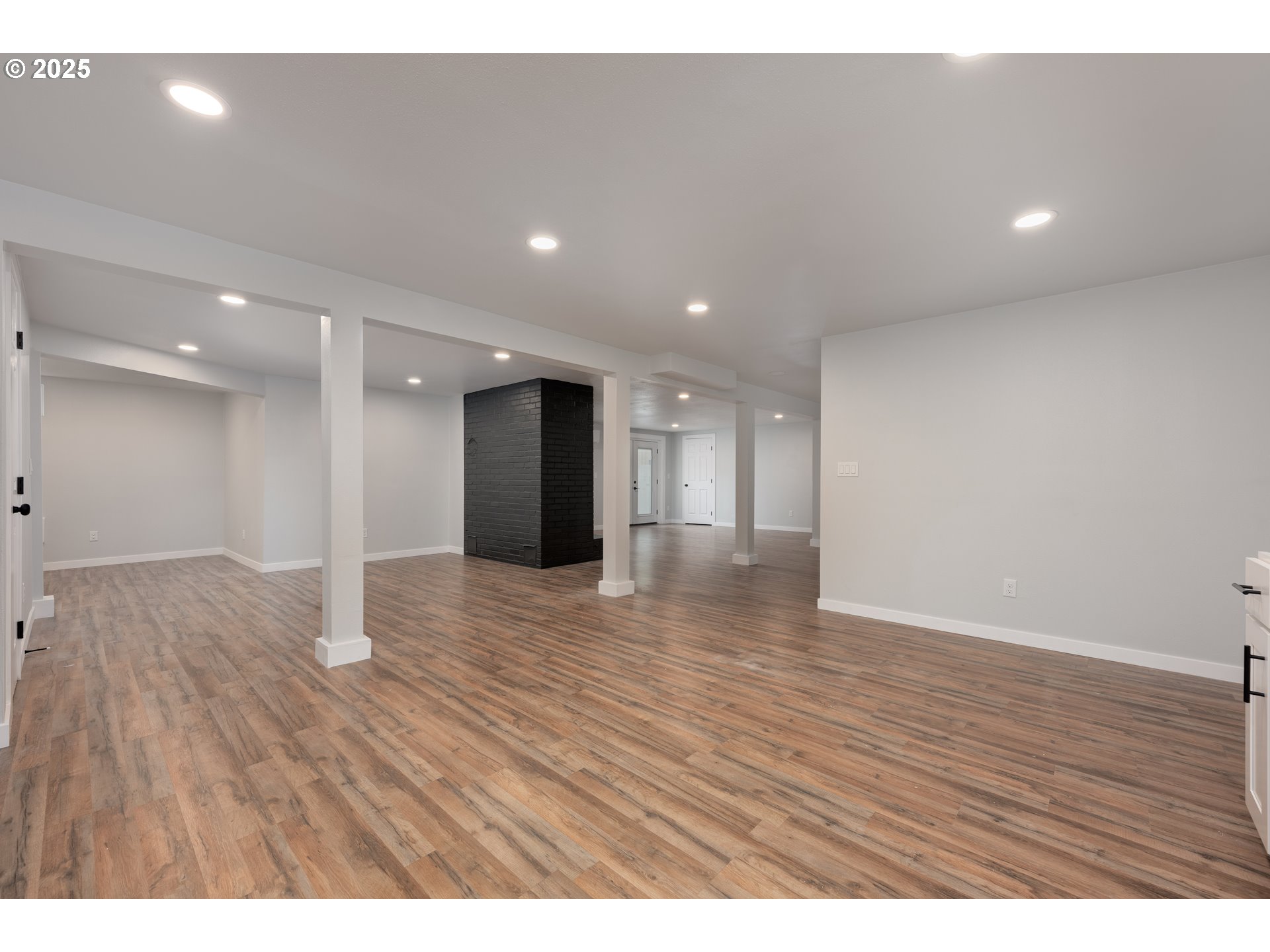 5775 Southeast Cesar Estrada Chavez Boulevard Portland, OR 97202 - Photo 24 of 43 a view of an empty room with wooden floor