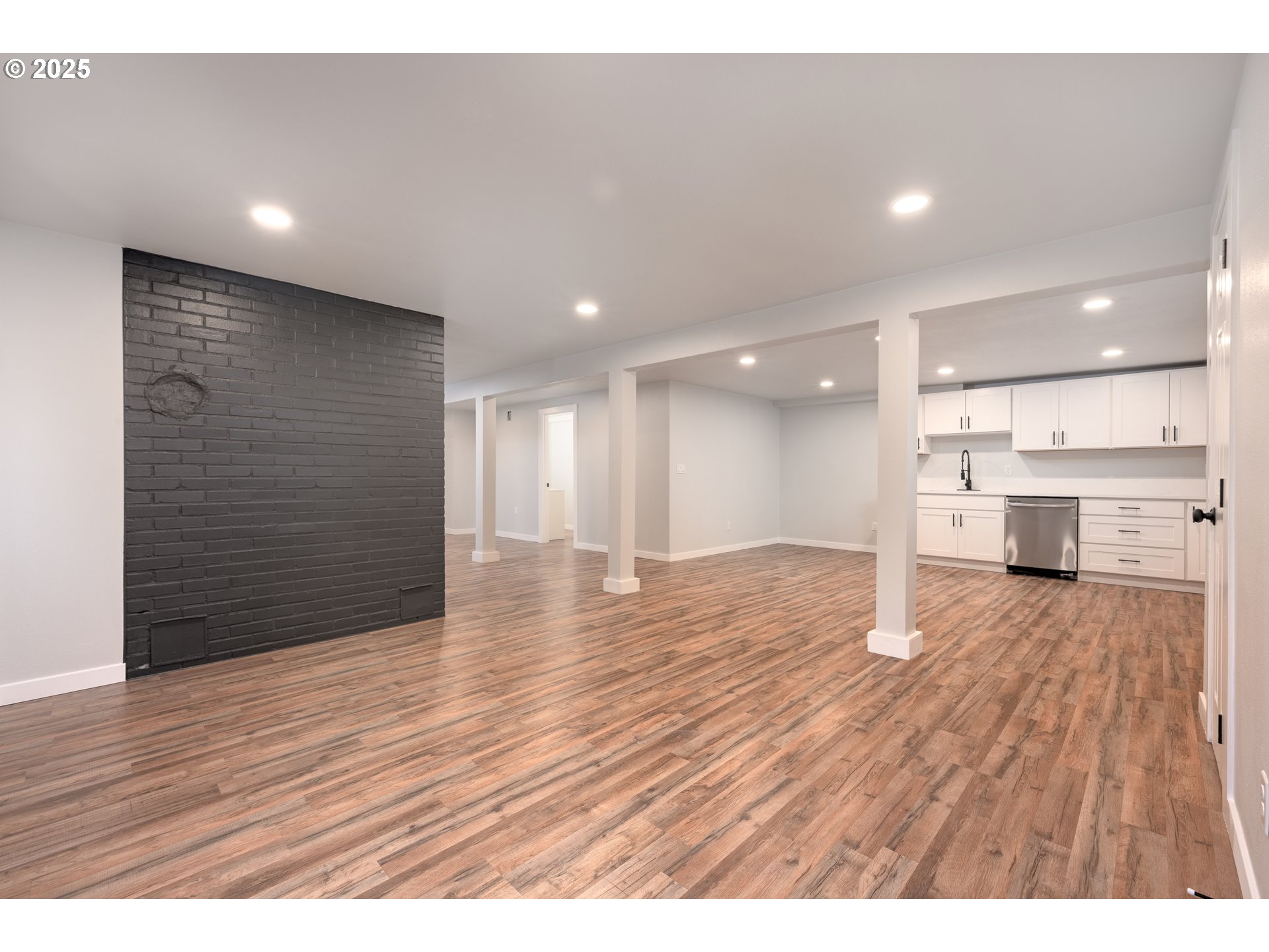 5775 Southeast Cesar Estrada Chavez Boulevard Portland, OR 97202 - Photo 25 of 43 a view of an empty room with wooden floor