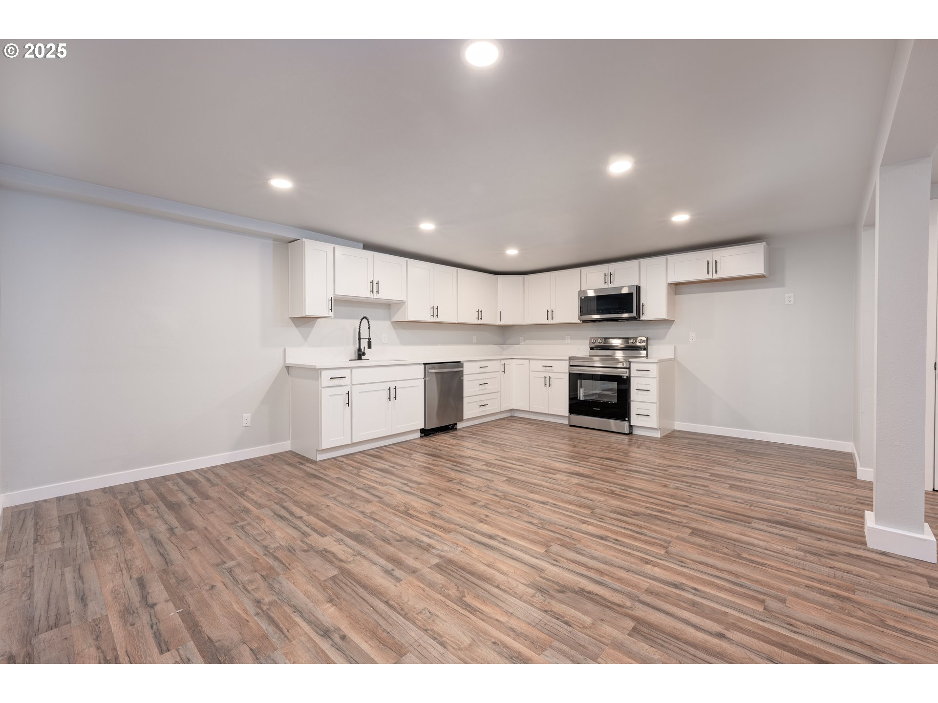 5775 Southeast Cesar Estrada Chavez Boulevard Portland, OR 97202 - Photo 27 of 43 a view of kitchen with wooden floor