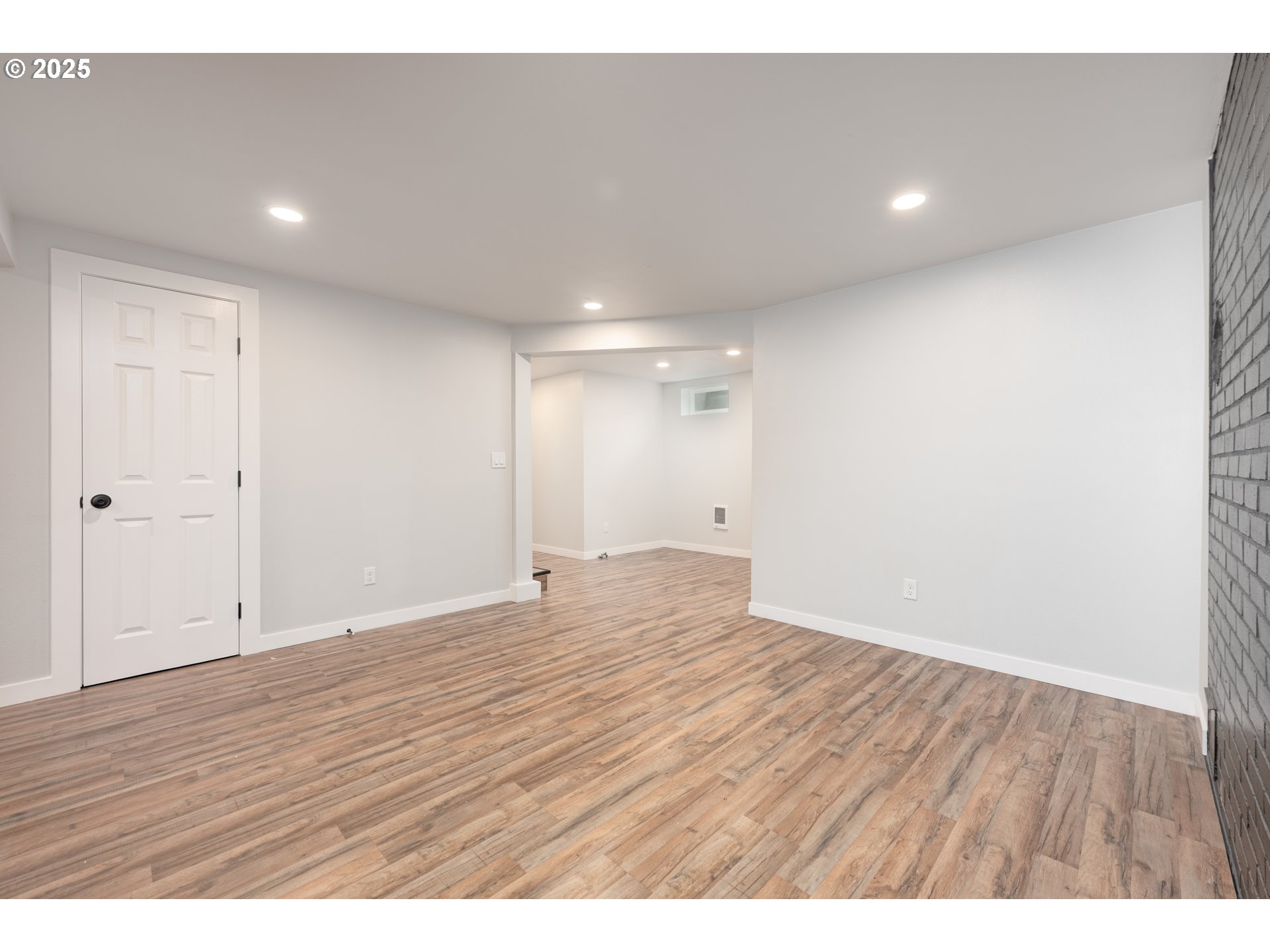 5775 Southeast Cesar Estrada Chavez Boulevard Portland, OR 97202 - Photo 35 of 43 a view of an empty room with wooden floor