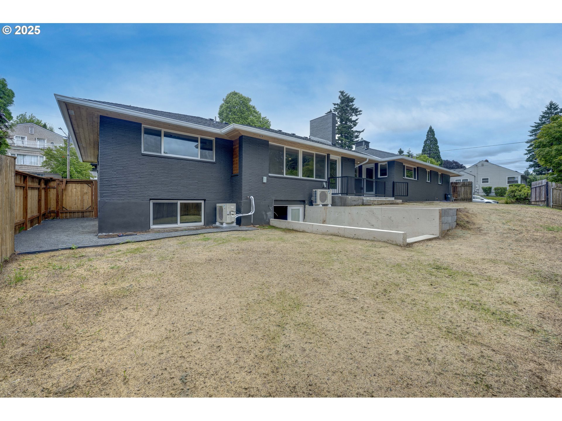 5775 Southeast Cesar Estrada Chavez Boulevard Portland, OR 97202 - Photo 40 of 43 a front view of a house with a yard