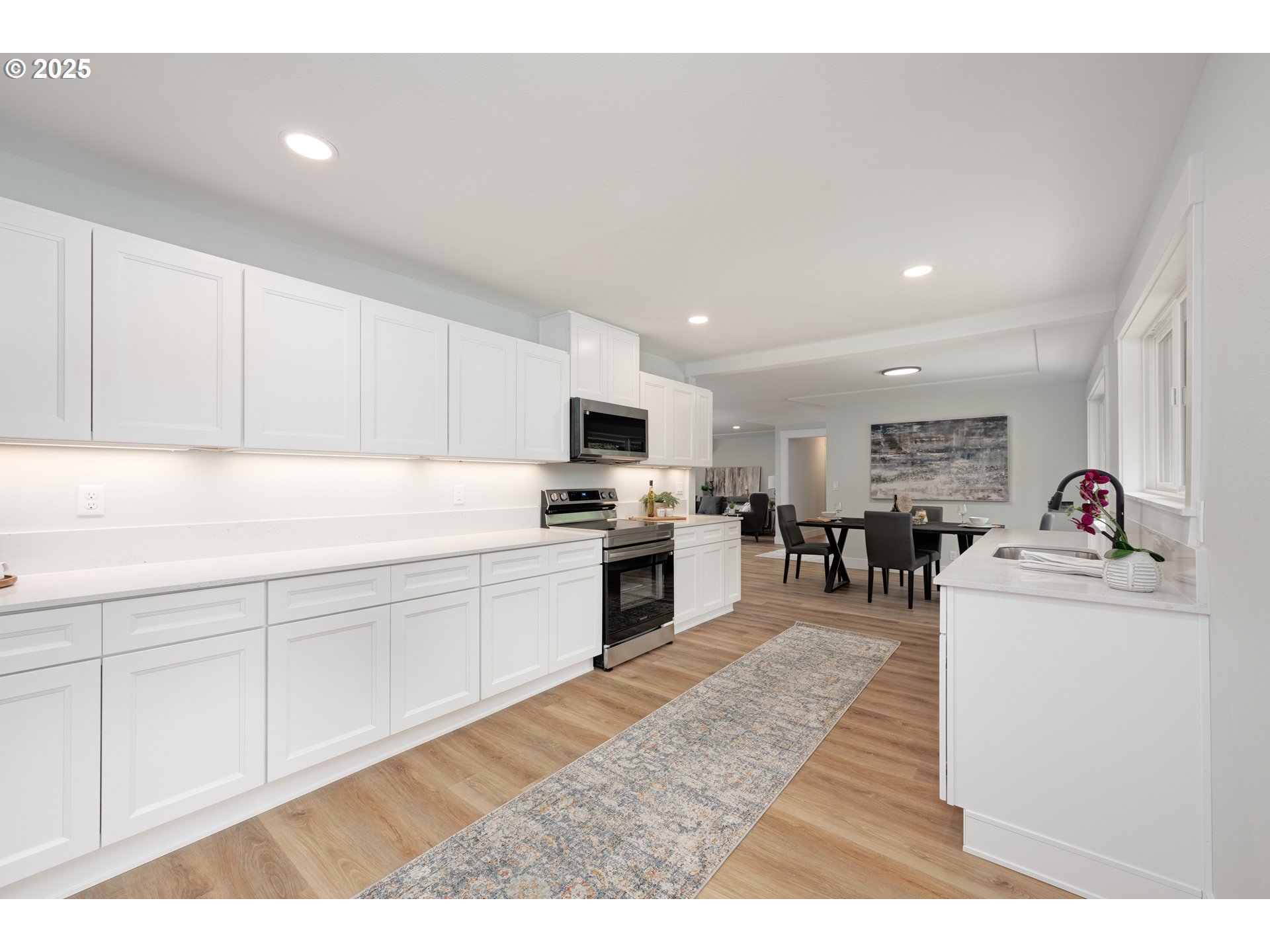 5775 Southeast Cesar Estrada Chavez Boulevard Portland, OR 97202 - Photo 7 of 43 a kitchen with granite countertop a sink stainless steel appliances and cabinets