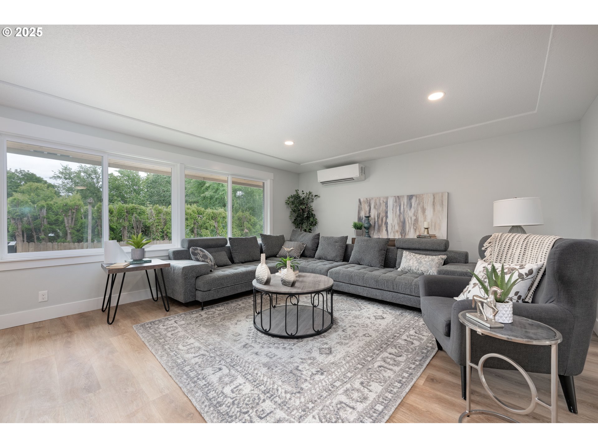 5775 Southeast Cesar Estrada Chavez Boulevard Portland, OR 97202 - Photo 9 of 43 a living room with furniture and a large window