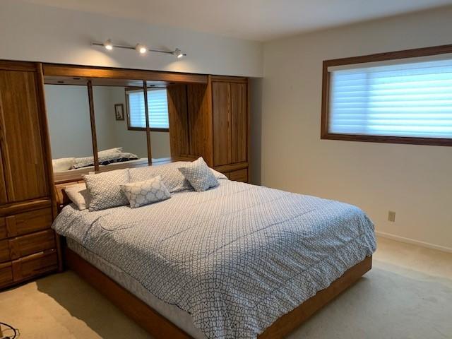 6288 Muirfield Drive Goleta, CA 93117 - Photo 11 of 26 a bedroom with a large bed and a window