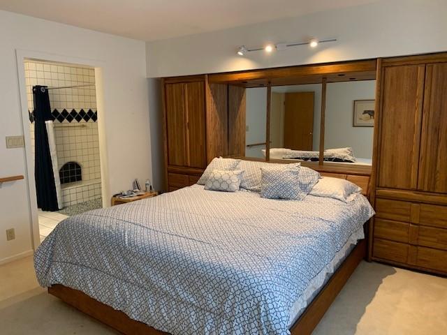 6288 Muirfield Drive Goleta, CA 93117 - Photo 12 of 26 a bedroom with a bed and a mirror