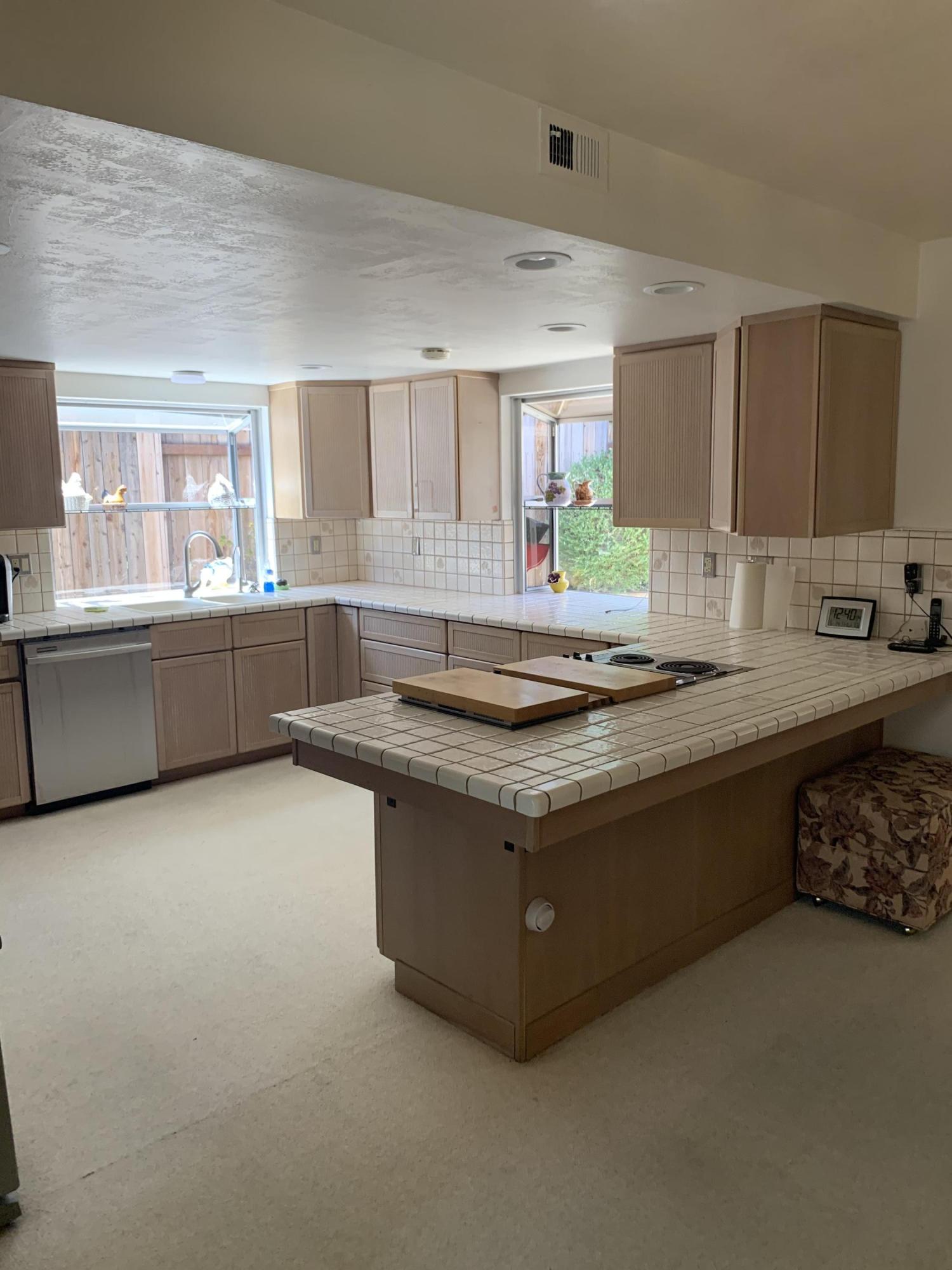 6288 Muirfield Drive Goleta, CA 93117 - Photo 3 of 26 a kitchen with granite countertop a sink and a stove