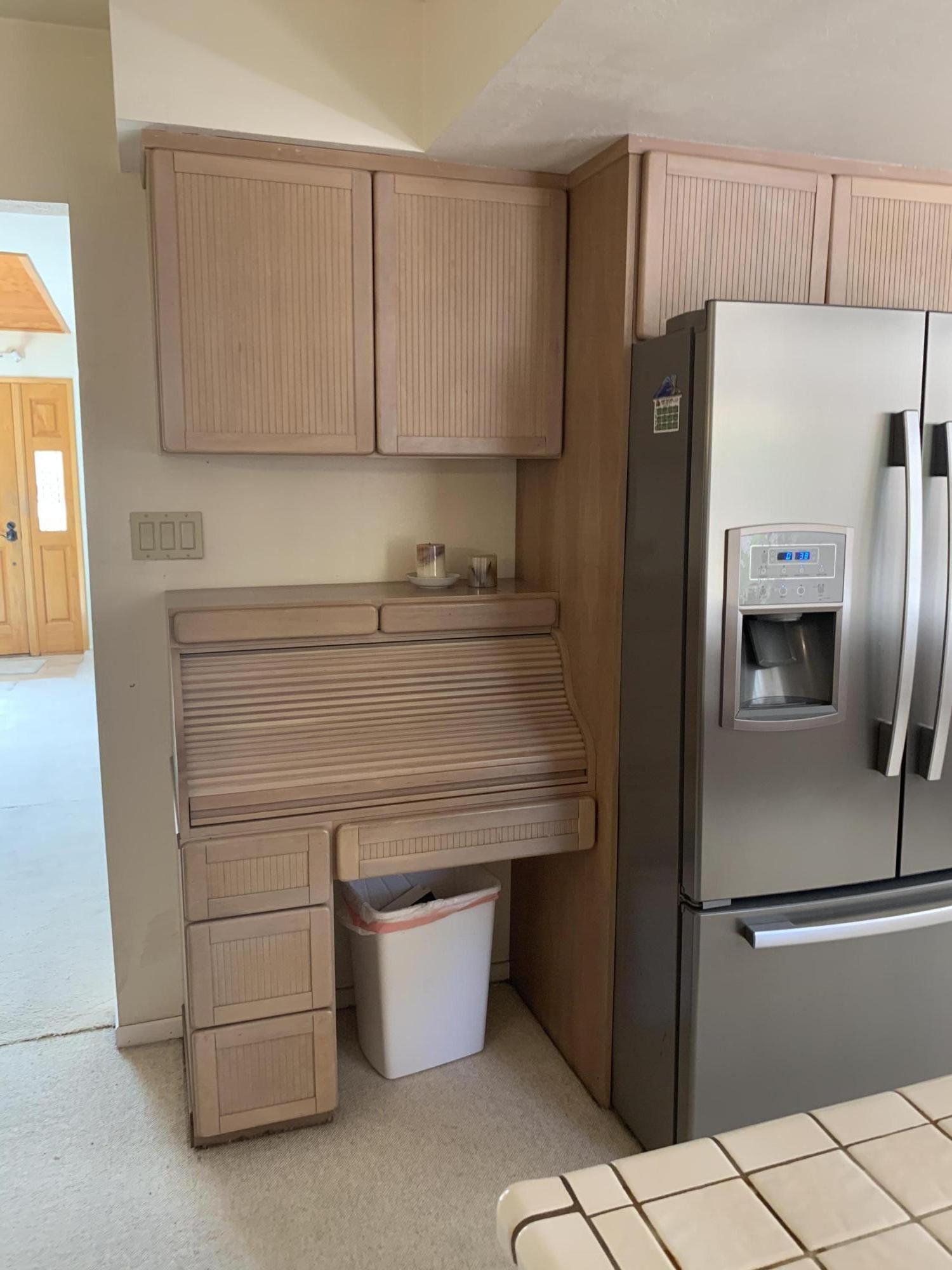 6288 Muirfield Drive Goleta, CA 93117 - Photo 4 of 26 a kitchen with a refrigerator sink and cabinets