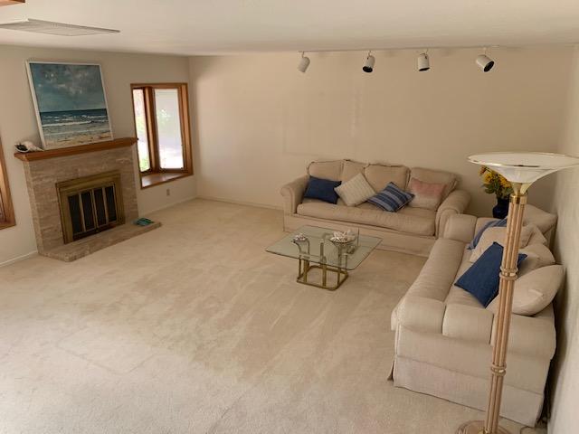 6288 Muirfield Drive Goleta, CA 93117 - Photo 7 of 26 a living room with furniture and a fireplace