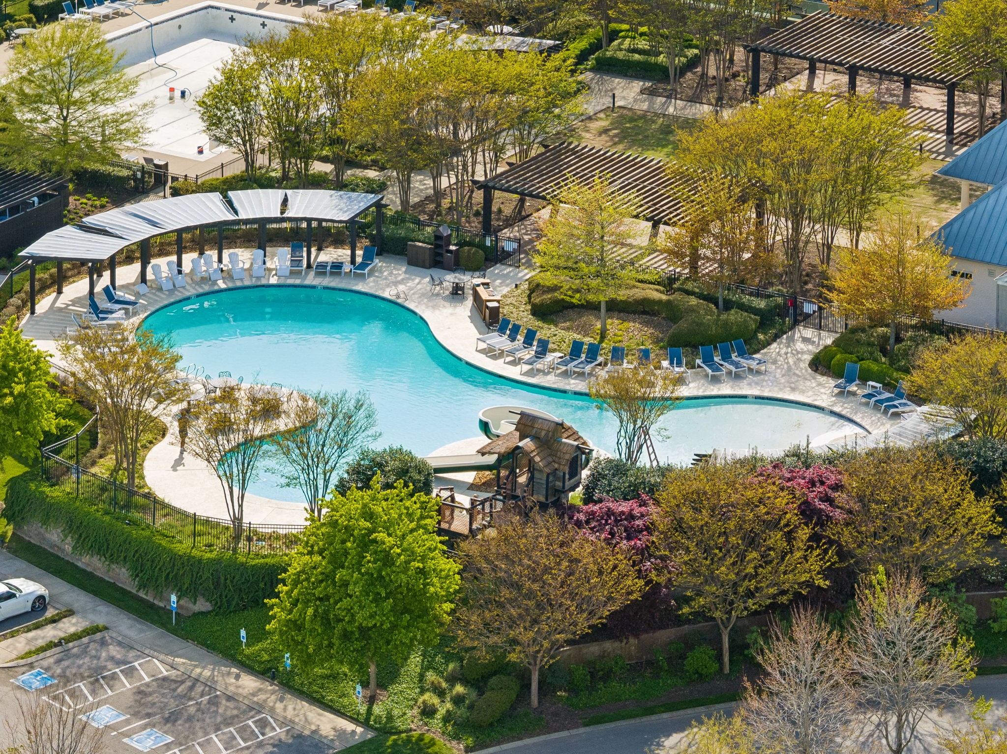 6033 Native Pony Trail College Grove, TN 37046 - Photo 87 of 87 a view of a swimming pool with a patio and a garden