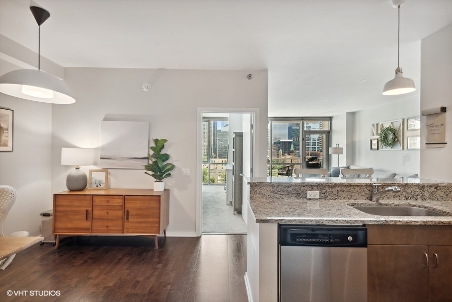 123 South Green Street, Unit 805B Chicago, IL 60607 - Photo 6 of 18 a view of living room with granite countertop furniture and wooden floor