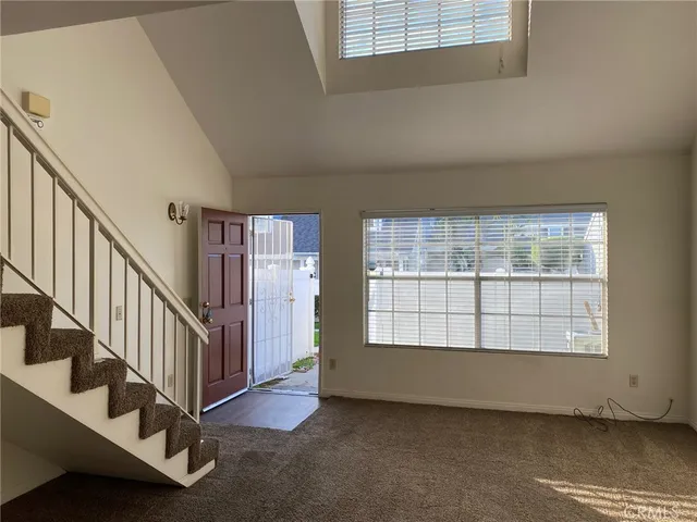 a view of an empty room with stairs