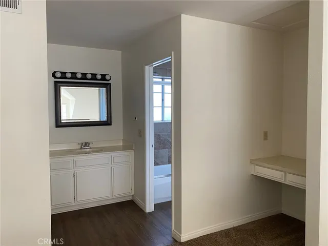 a white toilet sitting next to a shower