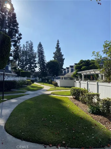 a view of a swimming pool with a yard