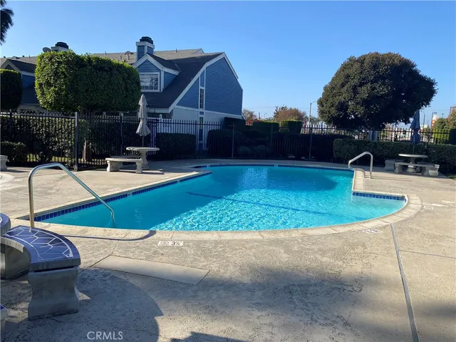 a view of a swimming pool with a patio