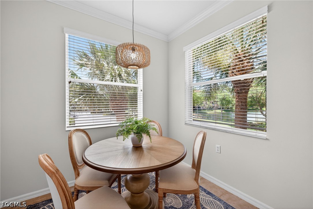 8251 Pathfinder Loop, Unit 621 Fort Myers, FL 33919 - Photo 8 of 30 a view of a dining room with furniture window and outside view