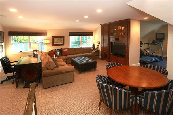 63 Sheffield Road Boxford, MA 01921 - Photo 13 of 30 a living room with furniture a large window and a refrigerator