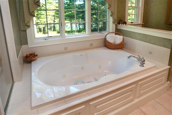 63 Sheffield Road Boxford, MA 01921 - Photo 20 of 30 a bathroom with a bathtub and window