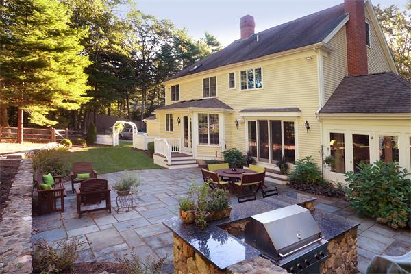 63 Sheffield Road Boxford, MA 01921 - Photo 25 of 30 a view of a house with backyard sitting area and garden