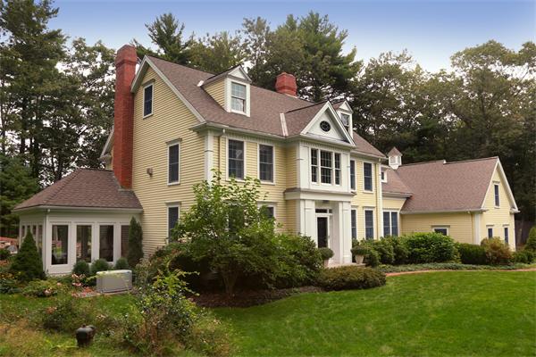 63 Sheffield Road Boxford, MA 01921 - Photo 30 of 30 a front view of a house with a yard and trees