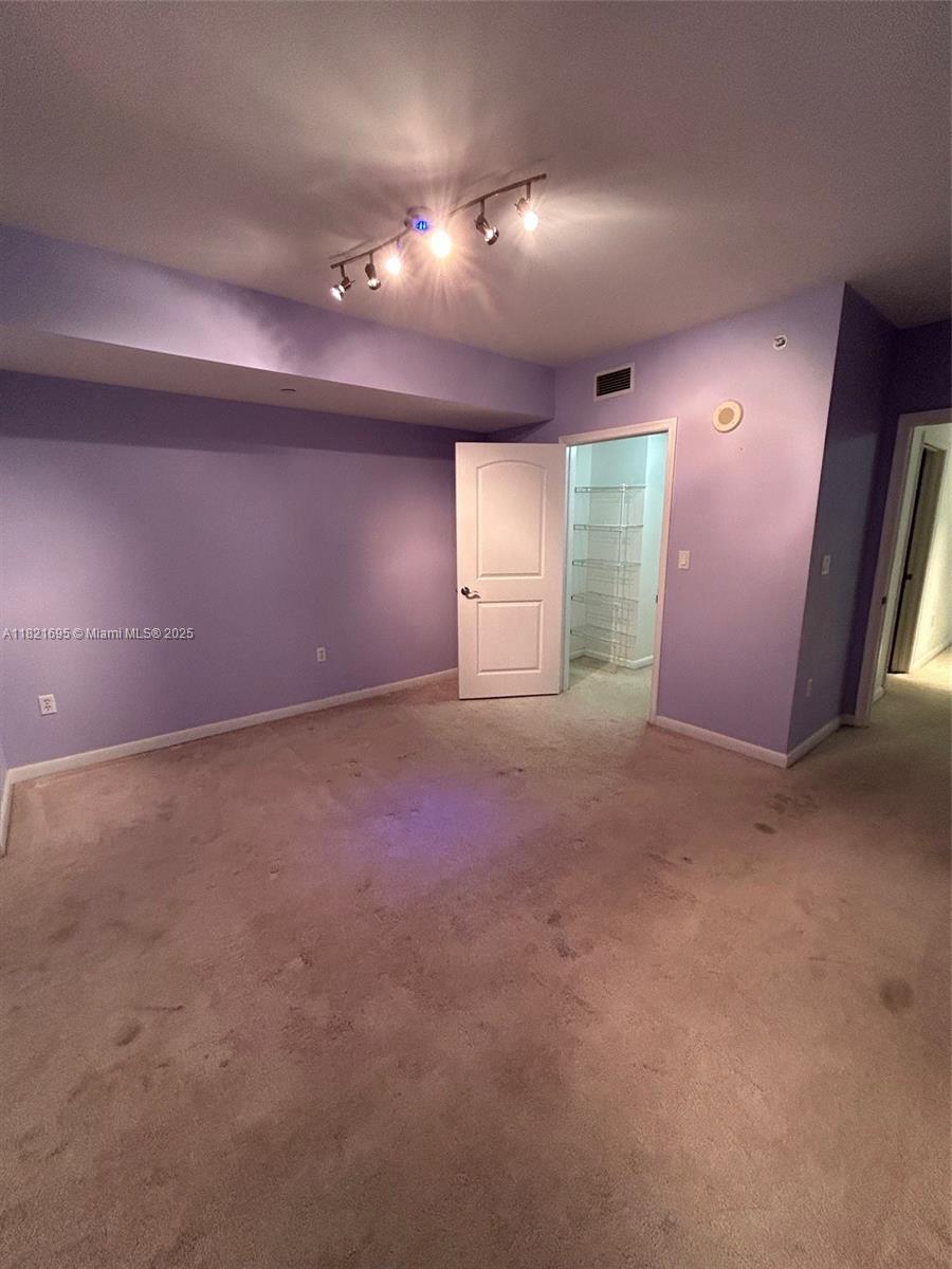 Kendall Miami, FL 33156 - Photo 3 of 16 an empty room with windows and fireplace