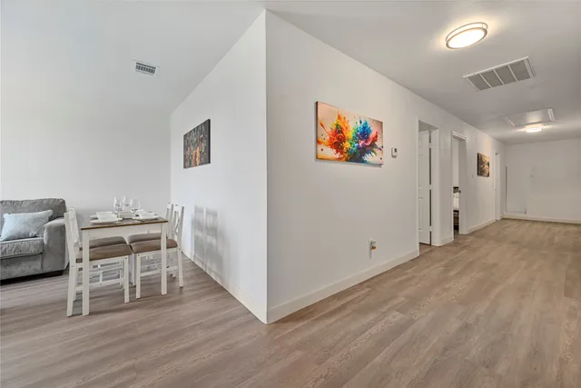 a view of a livingroom with furniture and wooden floor