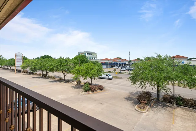 a view of a swimming pool and lounge chair