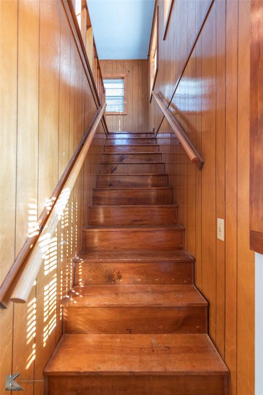 405 South Hinton Street Benjamin, TX 79505 - Photo 19 of 40 Staircase featuring wooden walls