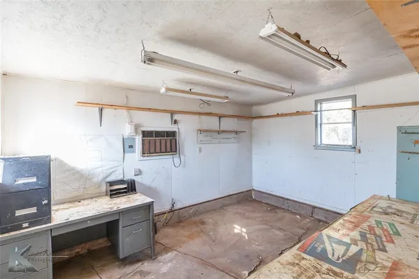 a backyard of a house with plants and trees