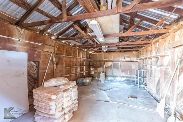 an aerial view of a house with a yard and garden