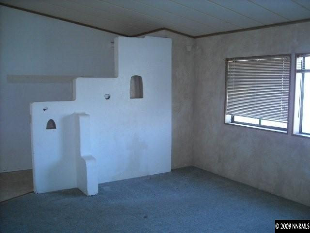 17290 Sunbird Lane Reno, NV 89508 - Photo 4 of 9 a view of a storage & utility room with a fridge
