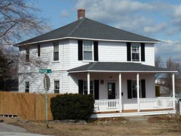 55 Marion Road Scituate, MA 02066 - Photo 11 of 16 a front view of a house with a garden