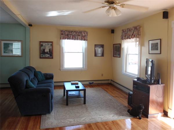 55 Marion Road Scituate, MA 02066 - Photo 2 of 16 a living room with furniture and a window