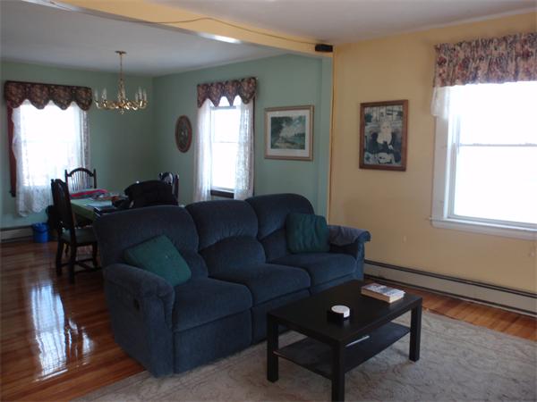 55 Marion Road Scituate, MA 02066 - Photo 3 of 16 a living room with furniture a lamp and a window