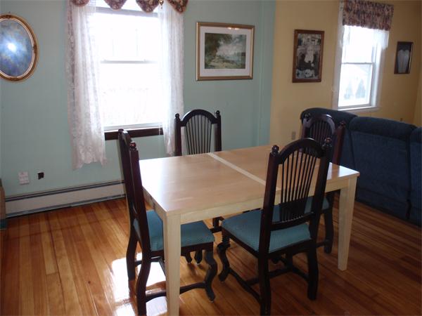 55 Marion Road Scituate, MA 02066 - Photo 6 of 16 a view of a dining room with furniture and window