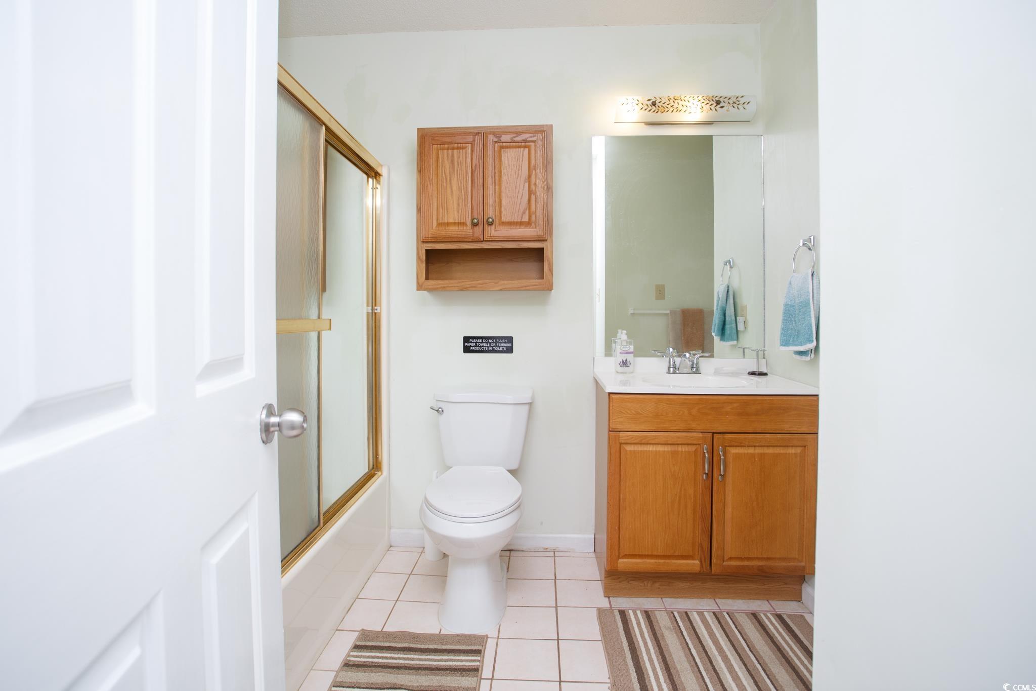 1356 Glenns Bay Road, Unit 201B Surfside Beach, SC 29575 - Photo 17 of 37 Full bath with light tile patterned flooring, show