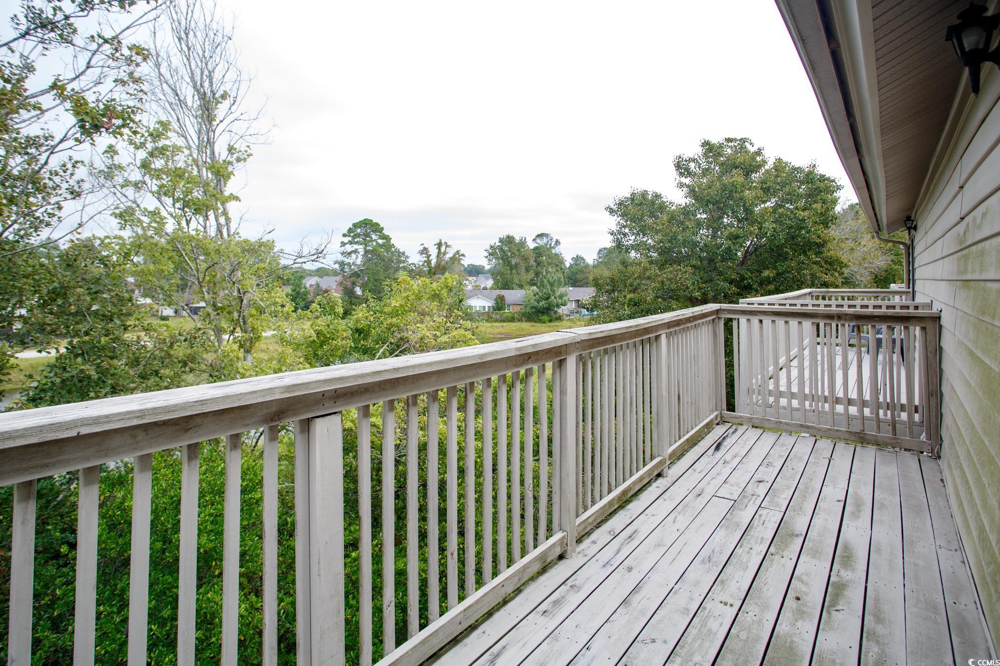 1356 Glenns Bay Road, Unit 201B Surfside Beach, SC 29575 - Photo 21 of 37 View of wooden deck