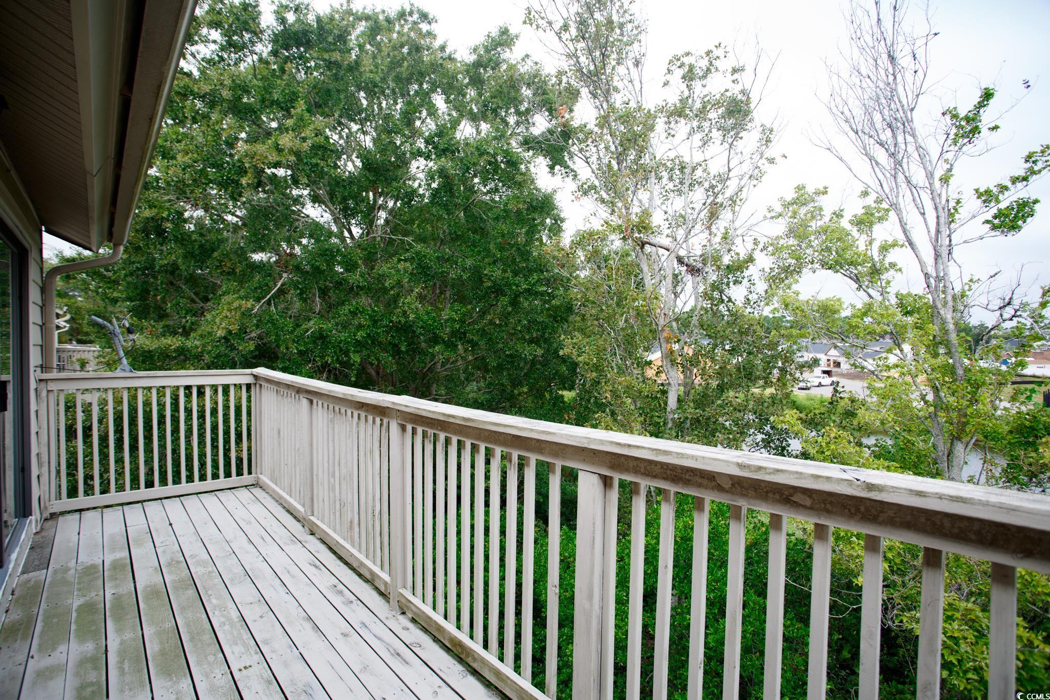 1356 Glenns Bay Road, Unit 201B Surfside Beach, SC 29575 - Photo 22 of 37 View of wooden deck