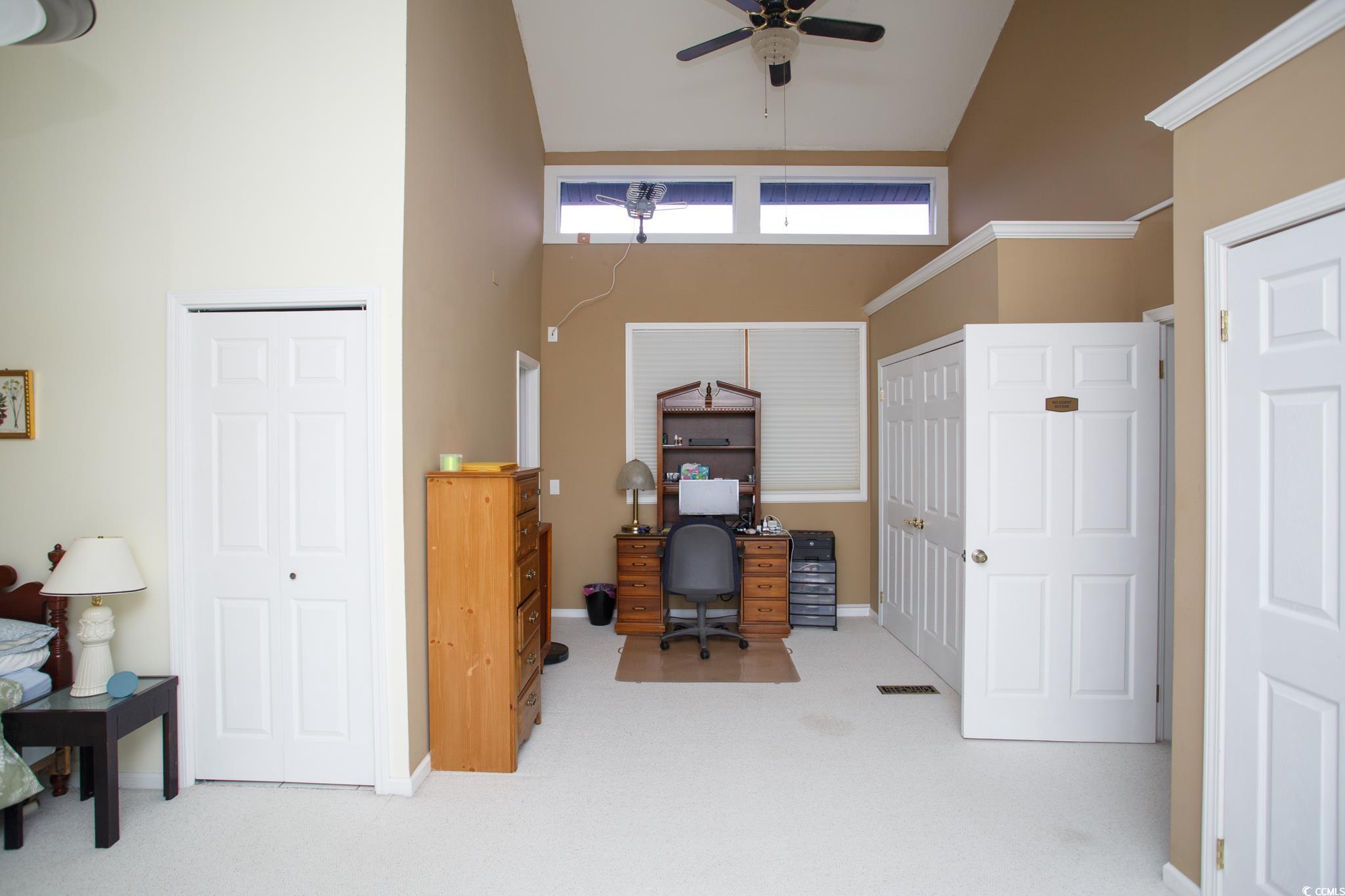 1356 Glenns Bay Road, Unit 201B Surfside Beach, SC 29575 - Photo 29 of 37 Office area with high vaulted ceiling, light carpe