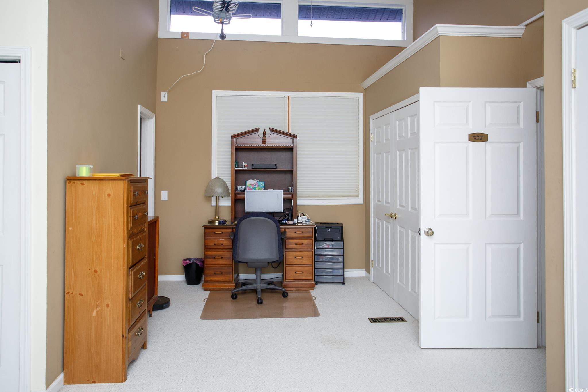 1356 Glenns Bay Road, Unit 201B Surfside Beach, SC 29575 - Photo 30 of 37 Carpeted office featuring a towering ceiling